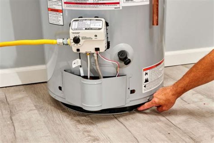 How do I convert my RV hot water heater from gas to electric?
