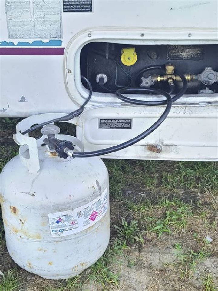 How do I know my camper fridge is running on propane?
