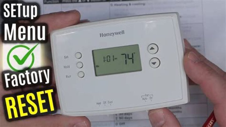 How do I reset my thermostat to factory settings?