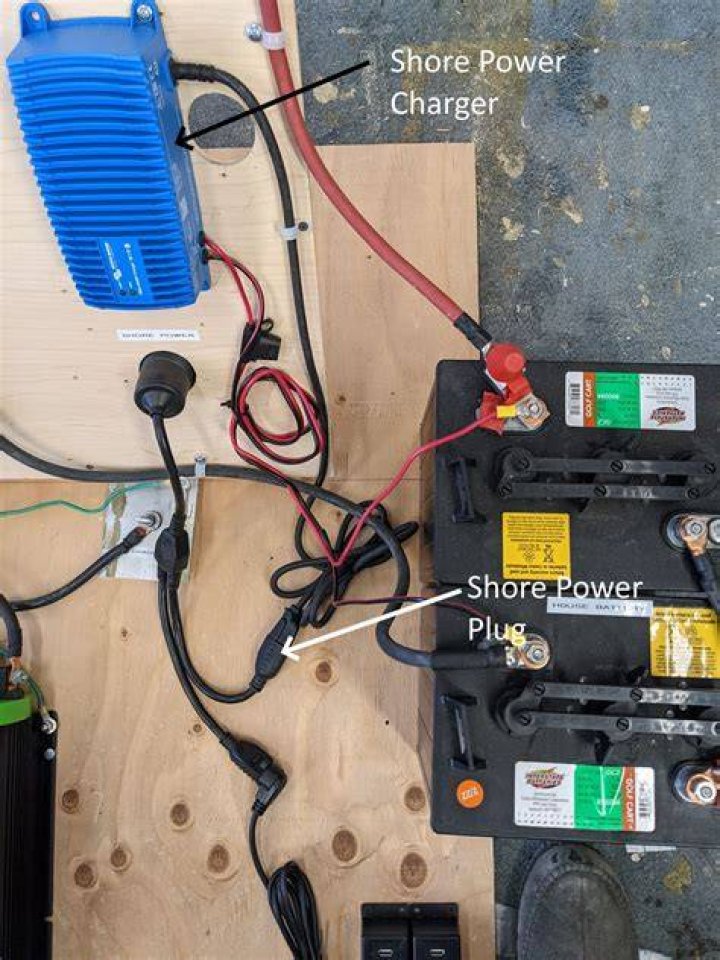 How do you charge solar batteries with shore power?
