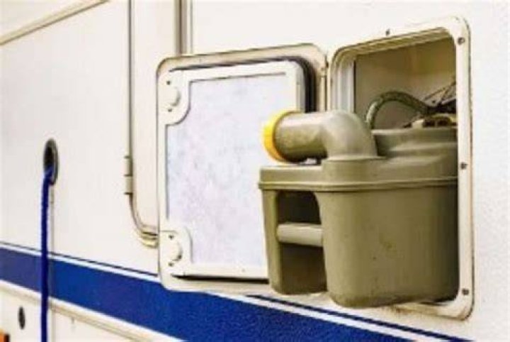 How do you clean a chemical toilet in a caravan?