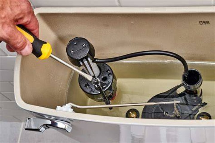 What do I need to know about replacing a toilet tank?